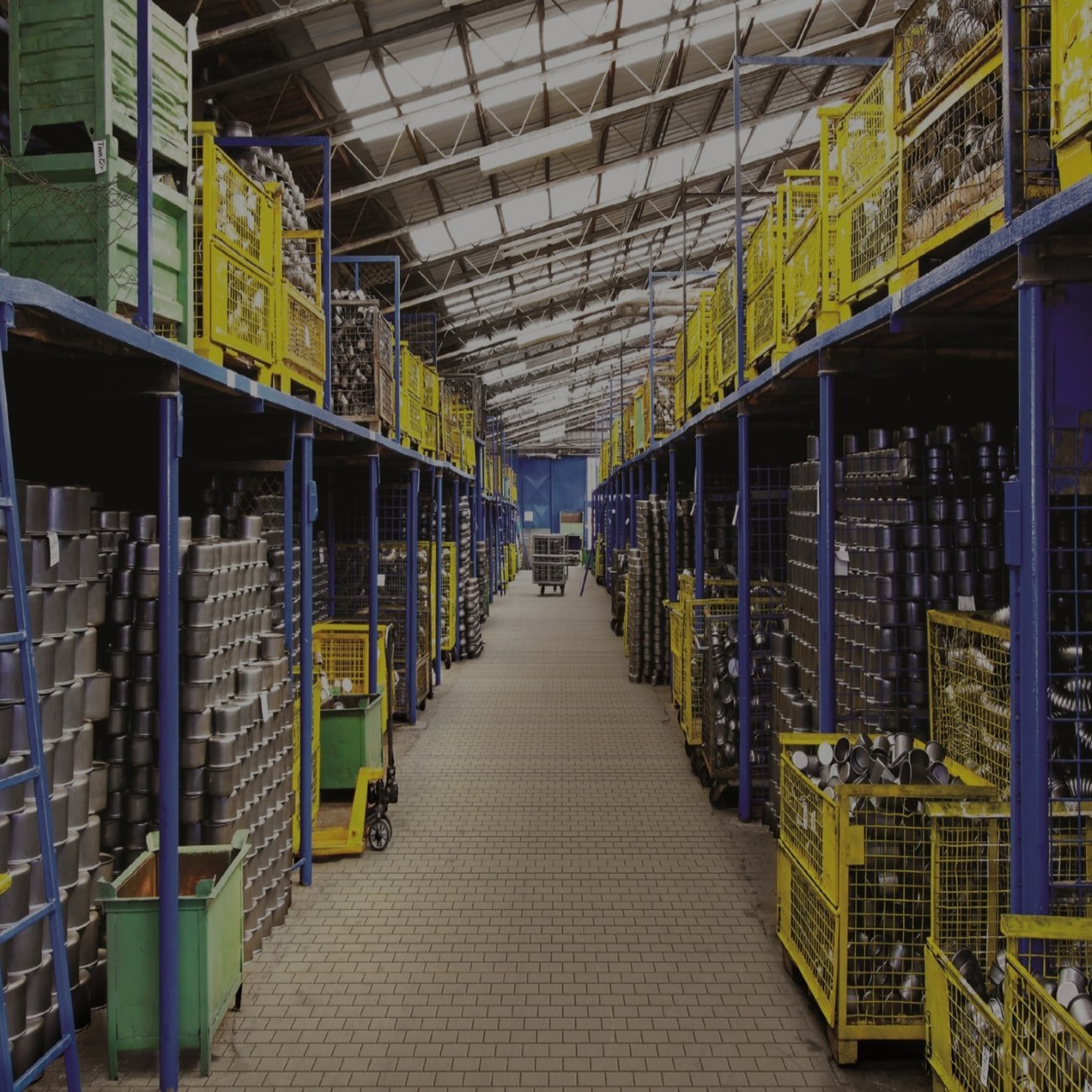 Warehouse aisle with shelves loaded with battery storage units